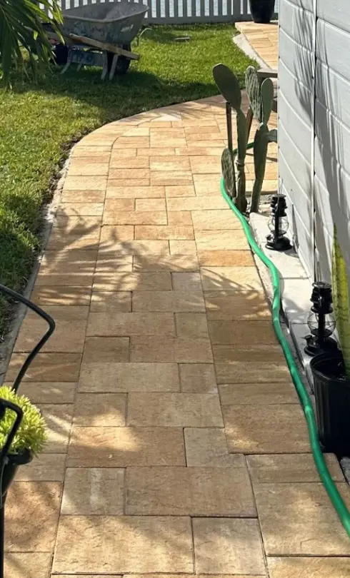 Tan paver walkway in the same side yard after installation